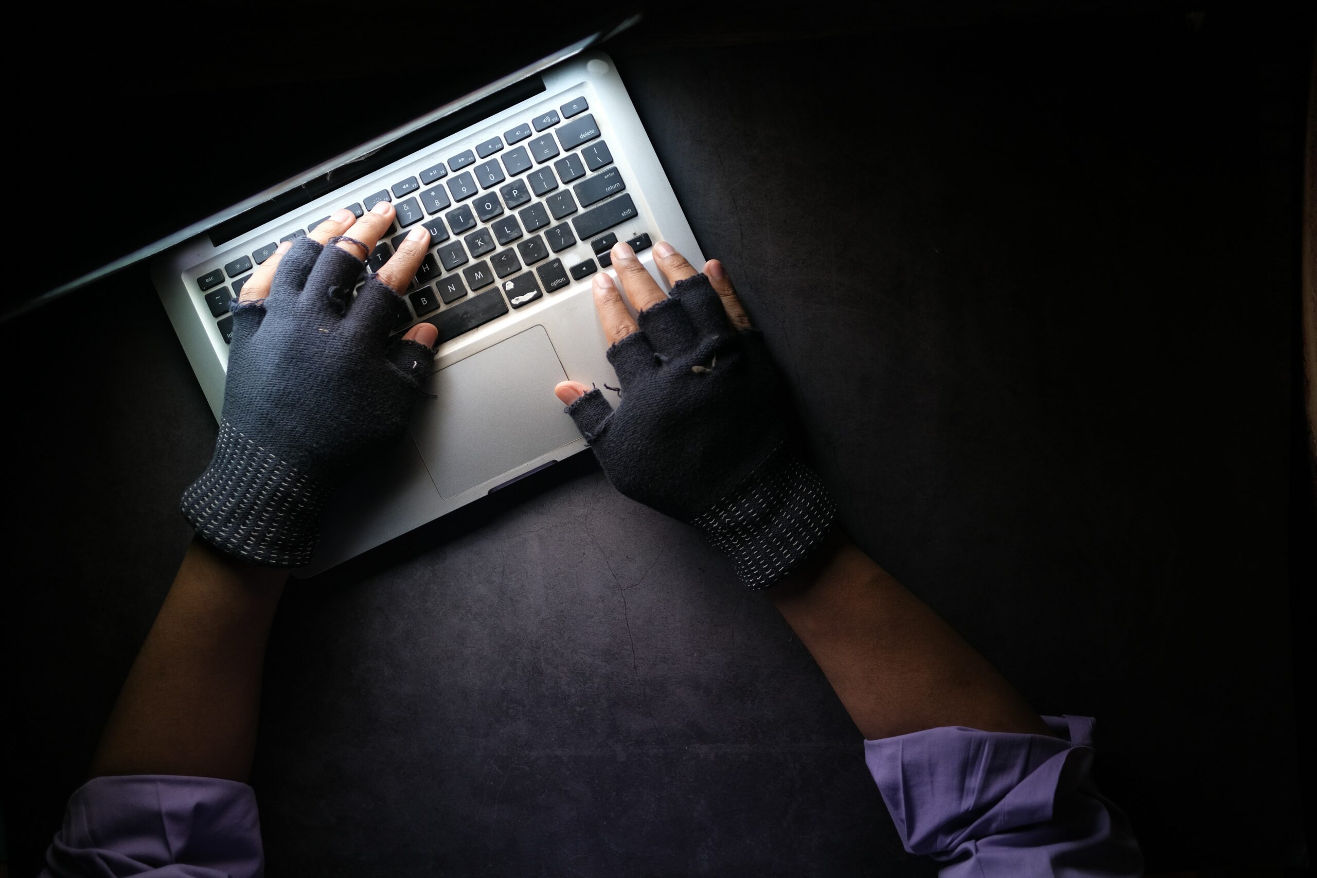 image of hacker using laptop